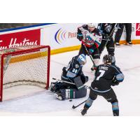 Kelowna Rockets centre Matthew	Wedman (top) takes a shot against the Winnipeg ICE