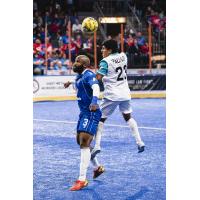 Kansas City Comets defender Ray Lee (left) battles the St. Louis Ambush