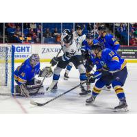 Tulsa Oilers goaltender Devin Williams tries to hold off the Wichita Thunder