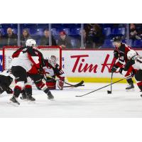 Vancouver Giants centre Milos Roman (right) prepares to shoot vs. the Prince George Cougars
