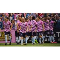 Forward Madison FC in their flamingos' pink-patterned alternate jersey