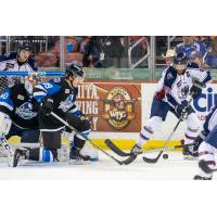 Tulsa Oilers forward Adam Pleskach (right) vs. the Wichita Thunder defense