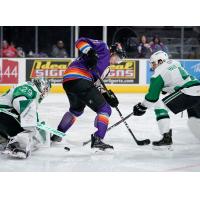 Jordan Nolan of the San Antonio Chimuelos (Rampage) redirects a puck in front of Texas Stars goaltender Jake Oettinger