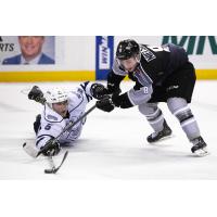 Vancouver Giants centre Tristen Nielsen (right) vies for the puck vs. the Victoria Royals