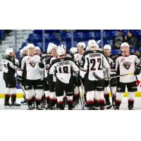 Vancouver Giants exchange congratulations following a win over the Kelowna Rockets
