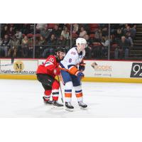 Binghamton Devils center Ben Street (left) vs. the  Bridgeport Sound Tigers