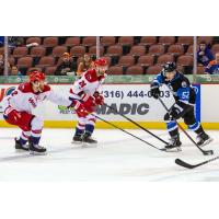 Alleb Americans defensemen Kayle Doetzel and Nick Boka (center) vs. the Wichita Thunder
