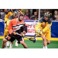Brendan Bomberry of the Georgia Swarm (right) defends against the Buffalo Bandits