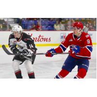 Vancouver Giants centre Eric Florchuk (left) vs. the Spokane Chiefs