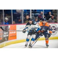 Tulsa Oilers defenseman Jake Clifford (right) vs. the Idaho Steelheads