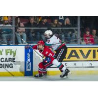 Kelowna Rockets centre Matthew Wedman (right) vs. the Spokane Chiefs