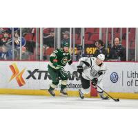 Andreas Borgman of the San Antonio Rampage skates away from the Iowa Wild's Mason Shaw