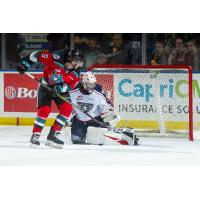 Kelowna Rockets left wing Mark Liwiski (left) against the Tri-City Americans