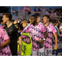 Forward Madison FC defender Josiah Trimmingham