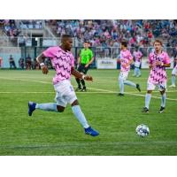 Forward Madison FC defender Josiah Trimmingham