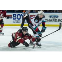 Kelowna Rockets right wing Jonas Peterek (right) vs. the Red Deer Rebels