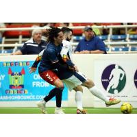 Alex Caceres of the Tacoma Stars fends off a Mesquite Outlaws defender