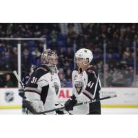 Vancouver Giants goaltender Trent Miner talks with defenceman Alex Kannok Leipert