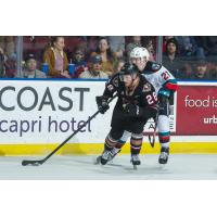 Kelowna Rockets right wing Jonas Peterek (right) vs. the Calgary Hitmen
