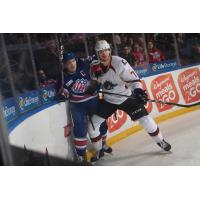 Cleveland Monsters left wing Paul Bittner (right) vs. the Rochester Americans