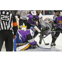 Utah Grizzlies goaltender Brad Barone and his defense battle the Kansas City Mavericks
