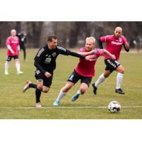 Louisville City FCmidfielder Corben Bone (left) vs. Forward Madison FC