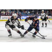 Vancouver Giants defenceman Bowen Byram (left) battles the Kamloops Blazers for the puck