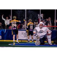 Jordan MacIntosh and Alex Crepinsek of the Georgia Swarm following a goal against the New York Riptide