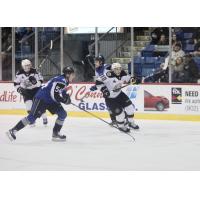 Saint John Sea Dogs defenceman Jeremie Poirier (left) vs. the Charlottetown Islanders