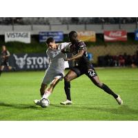 Las Vegas Lights FC striker Seku Conneh (right) vs. San Diego Loyal