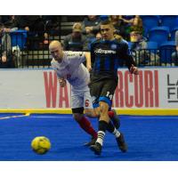 Kansas City Comets forward Adam James (left) vs. Utica City FC