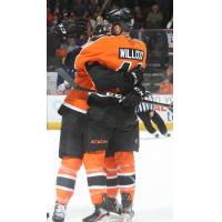 Reece Willcox of the Lehigh Valley Phantoms receives congratulations from his teammates