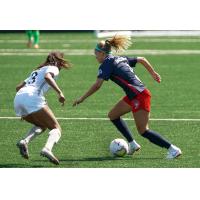 Washington Spirit defender Natalie Jacobs (right)