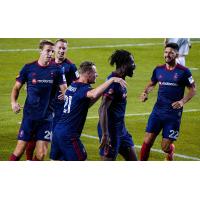 Chicago Fire FC forward CJ Sapong receives congratulations after his goal