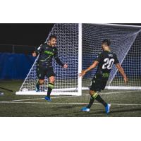 York9 FC striker Alvaro Rivero (left) celebrates with teammate Diyaeddine Abzi