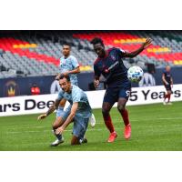Chicago Fire FC forward CJ Sapong (right) vs. Sporting Kansas City