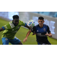 San Jose Earthquakes midfielder Cristian Espinoza (right) vs. Seattle Sounders FC