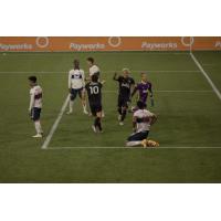Seattle Sounders FC celebrate a goal against the Vancouver Whitecaps