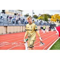 Forward Madison FC goalkeeper Chris Brady