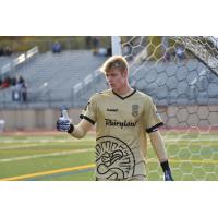 Forward Madison FC goalkeeper Chris Brady