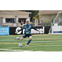 Forward Madison FC goalkeeper Chris Brady