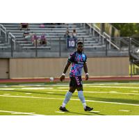 Forward Madison defender Josiah Trimmingham