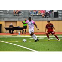 Forward Madison defender Josiah Trimmingham