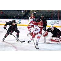 Corey Mackin of the Allen Americans (center) vs. the Rapid City Rush