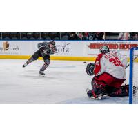 Allen Americans goaltender Justin Kapelmaster faces a shot from the Kansas City Mavericks
