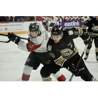 Charlottetown Islanders defenceman Noah Laaouan (right) vs. the Halifax Mooseheads