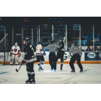 Officials separate the Odessa Jackalopes and Wichita Falls Warriors