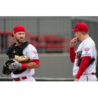 Catcher Logan Moore (left)