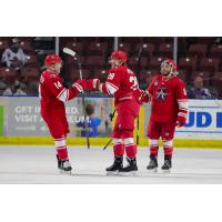 Allen Americans exchange congratulations after a Jesse Mychan goal