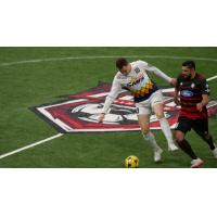 Tacoma Stars forward Nick Perera (10) fends off Ontario Fury defender Juan Topete